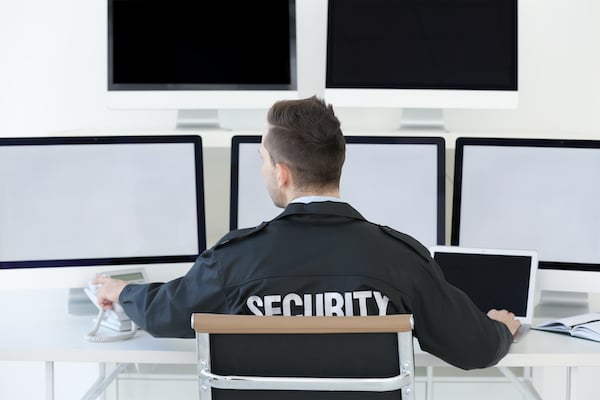 handsome-security-guard-surveillance-room